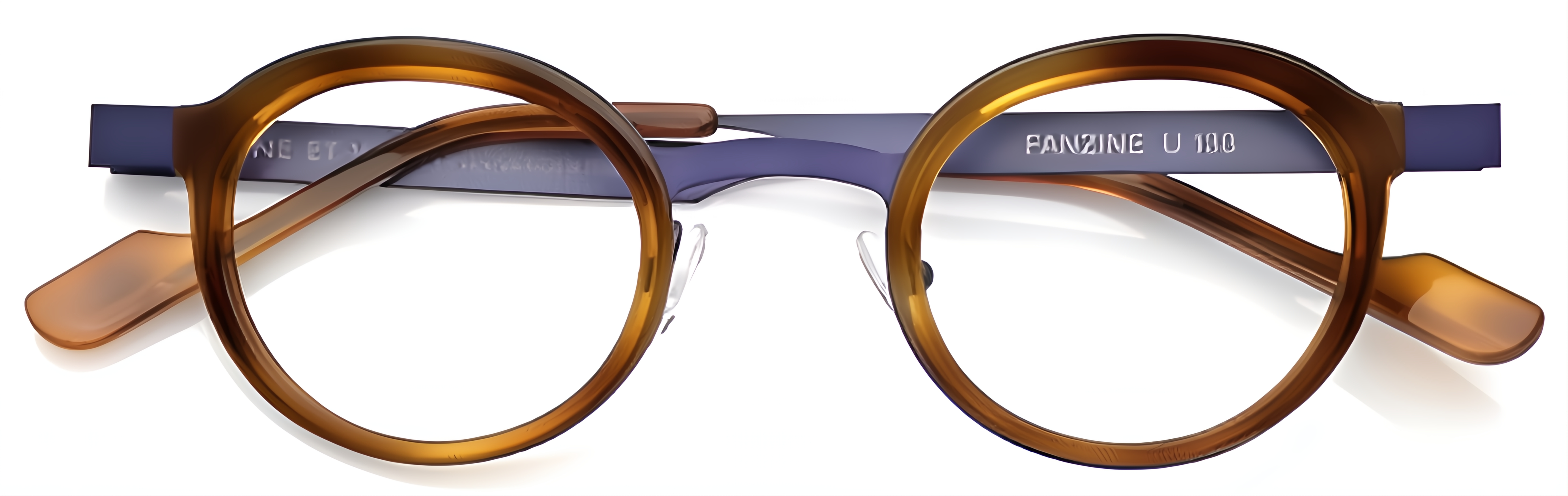 Round amber-brown acetate and navy metal glasses with slim rims, adjustable nose pads, and acetate temple tips